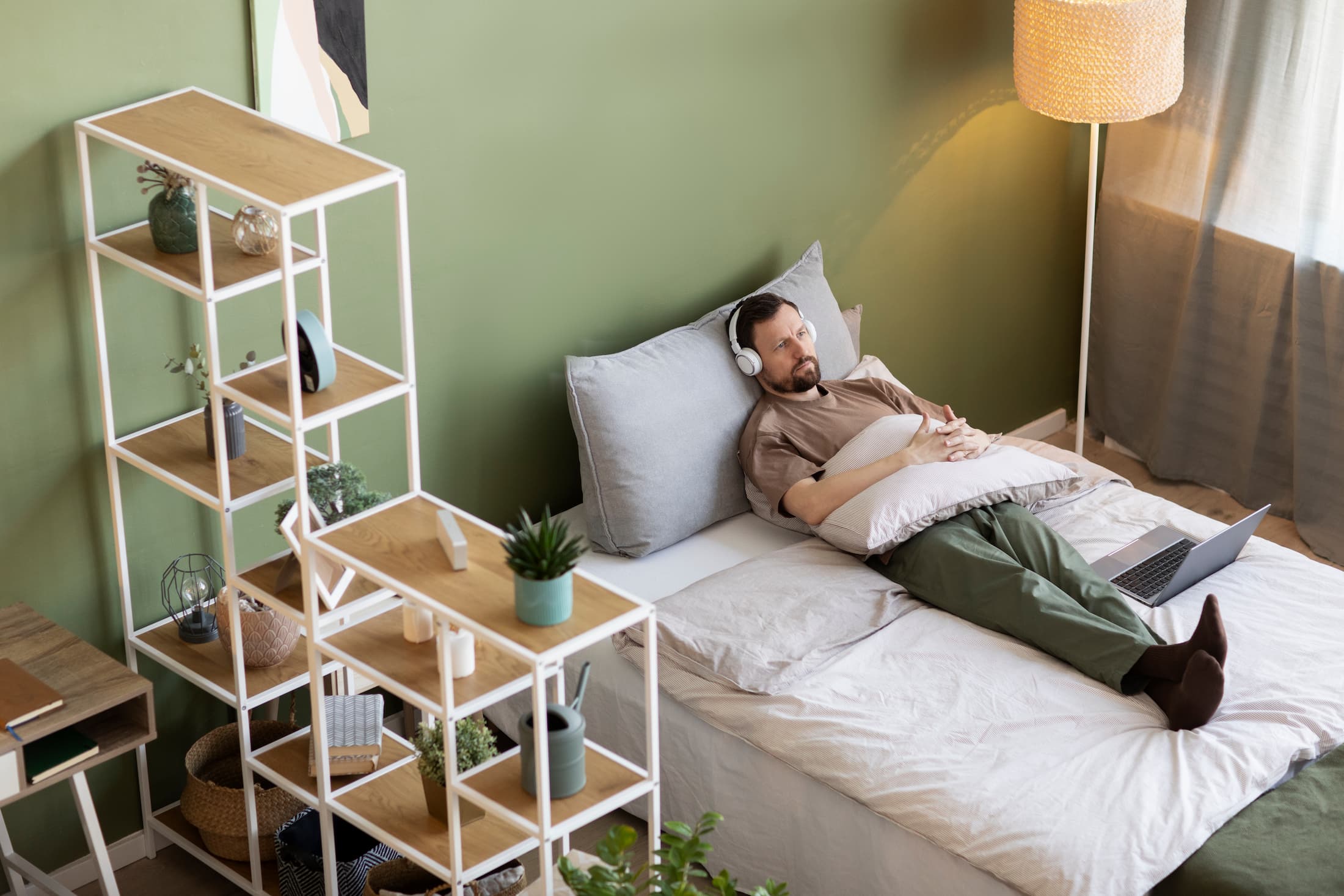 man-laying-bed-listening-music__1_.jpg